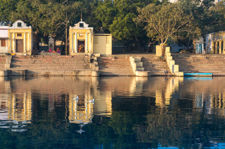 Yellow temples and hindu buildings on the yamuna ghat bank in Delhiのeditorial素材