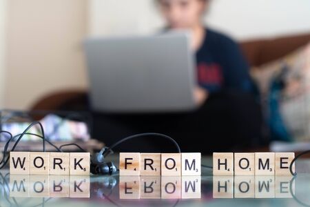 Young indian girl woman working from home with a laptopの写真素材