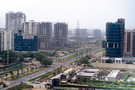 Gurgaon, Delhi, India - circa 2020 :shot showing the empty streets and intersection moving to sky scrapers with resedences, homes, offices and more in the modern city of gurgaon.Shows the empty streets and outdoors due to the lockdowns imposed during the のeditorial素材
