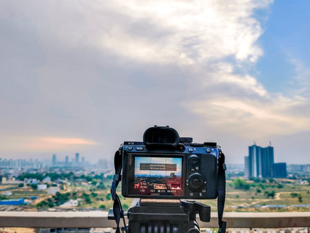 Dusk dawn shot of DSLR mirrorless camera on tripod shooting gurgaon cityscape long exposure timelapseのeditorial素材