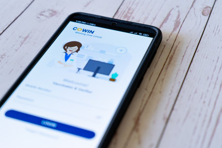 Login screen of Co-WIN app application screen used for tracking coronavirus covid19 vaccination of...