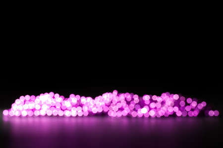 violet beads on a dark background, defocused
