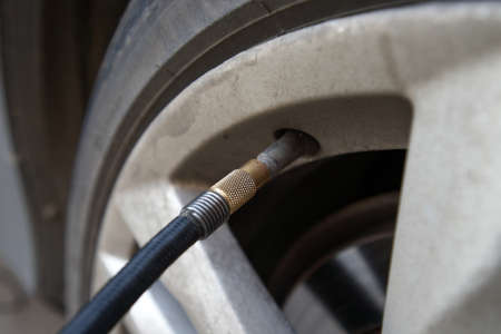 hose with nipple for pumping air into the wheels of the car