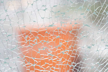 broken glass with cracks net, heavy defocused background
