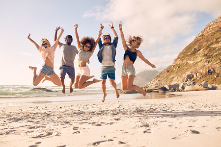 Group Of Friends Together On The Beach Having Fun Hy Young Group Of Friends Together On The Beach