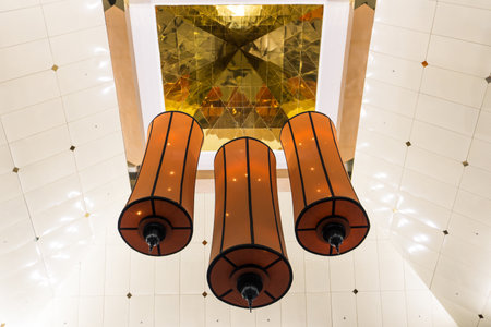 Hanging lamps in the interior of a modern shopping mall in Dubai, UAE