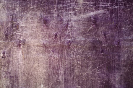 texture of old wooden plywood painted purple with scratchesの写真素材