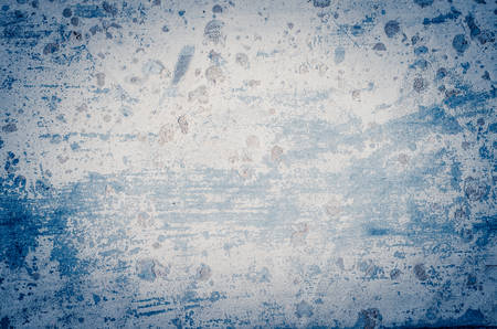 Texture of old wall with cracked paint. Blue vignette.