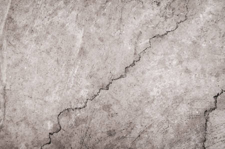 Piece of stone marble with cracks. Light beige texture