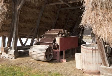 retro grain trasher and some specific agriculture  toolsの写真素材