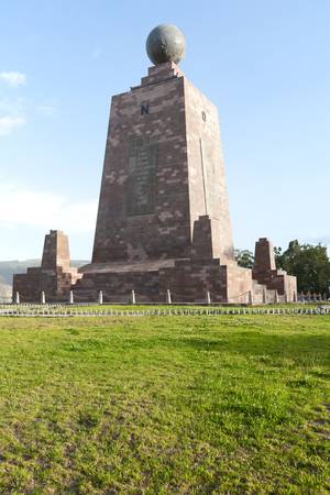 The 30-meter-tall monument, built between 1979 and 1982, was constructed to mark the point where the equator passes through the country in the geodetic datum in use in Ecuador at that time.The pyramidal monument, with each side facing a cardinal directionの写真素材