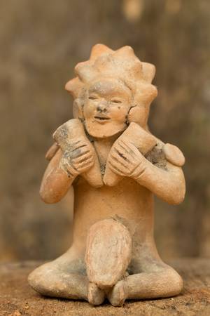 ceramic male figure representing a woman with two hammers. Part of ancient Tollita culture, Ecuador.(500 BC500 CE)の写真素材