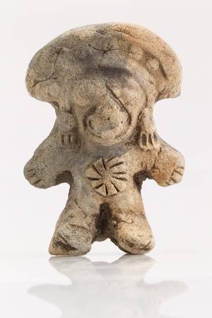 antique amulet from Valdivia culture representing an abstract beeing on white background. Part of La...