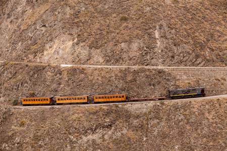 Train going up on Nariz del Diablo, very important tourist attraction in Ecuadorian Andes, one of the highest railorad route in the worldの写真素材