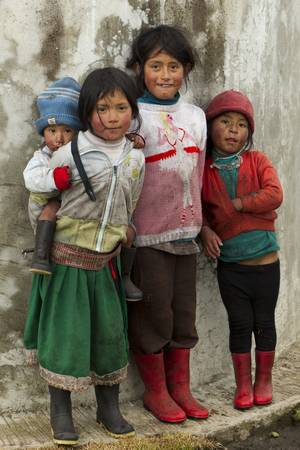 OZOGOCHE,ECUADOR - 2 NOVEMBER 2011: Group of dirty and poorly dressed kids  due to the lack of education and basic hygiene services living in a rural area of OZOGOCHE, ECUADOR on 2 NOVEMBER 2011のeditorial素材