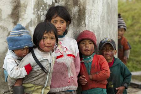 OZOGOCHE,ECUADOR - 2 NOVEMBER 2011: Group of dirty and poorly dressed kids  due to the lack of education and basic hygiene services living in a rural area of OZOGOCHE, ECUADOR on 2 NOVEMBER 2011のeditorial素材
