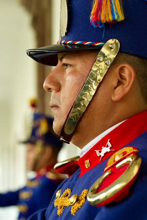 Quito,Ecuador - 14 July 2011: National guard dressed up in parade uniforms protects the entrance of presidential palace in Quito,Ecuador - 14 July 2011のeditorial素材