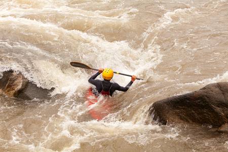 an active kayaker on the rough waterの写真素材