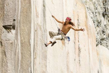 rock climber jump, may very well suggest a lover running to his girlfriend in classical rome &amp; juliet posture.の写真素材