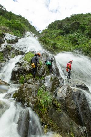 canyoning adventure team in chamana waterfall , banos de agua santa ecuador.の写真素材