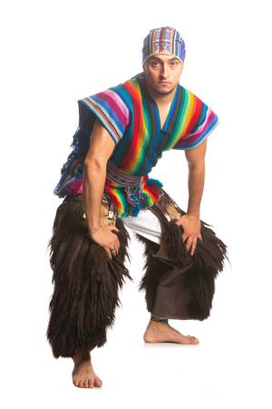 ecuadorian dancer dressed up in traditional costume from the highlands, llama or alpaca pants. studio shot isolated on white.の写真素材