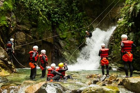 group of people having fun during a canyoning trip.の写真素材