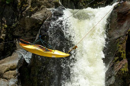 kayak suspende on a zipline, extreme sport themeの写真素材