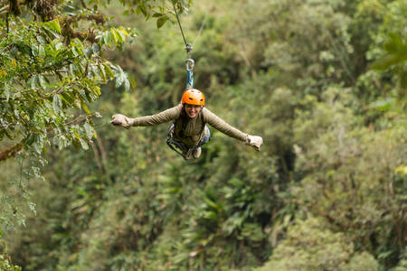 zipline adventure in ecuadorian rainforest, banos de agua santaの写真素材