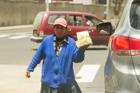 Ambato,Ecuador - January 24,2012: Since begging on the streets is ilegal, poor people sels...