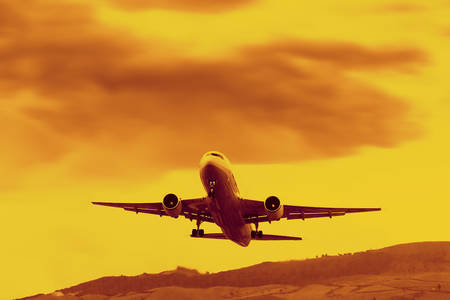 jet airplane takeoff at sunset time