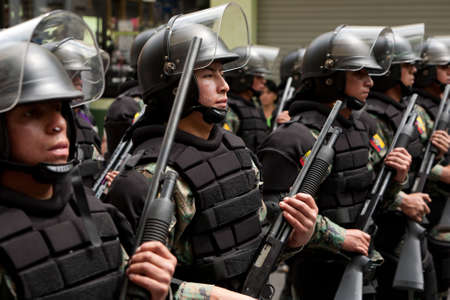 Banos De Agua Santa, Ecuador - 20 December 2011: Police Force Marching On The Streets In Banos De...