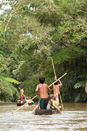 Macas, Ecuador - 21 December 2011: Children Driving Tourists Boats On The Pastaza River In Macas On December 21, 2011のeditorial素材