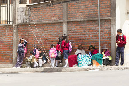 Salasaca, Ecuador - 24 January 2014: Street Snapshot With People Waiting For The Bus In Salasaca On January 24, 2014のeditorial素材