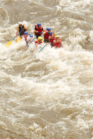 Group Of Mixed Tourist Men And Women With Guided By Professional Pilot On Whitewater River Rafting In Ecuadorの写真素材