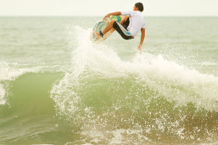 Surfer Ending The Wave With A Jump