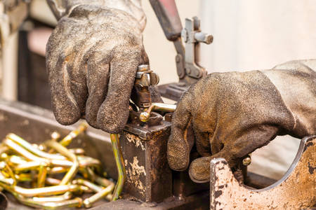 Automotive Industry Worker Wearing Used Protection Glovesの写真素材