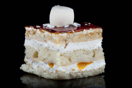 Delicious Cake With Caramel Isolated On Black Studio Shotの写真素材