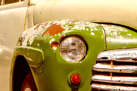 Old Rusted Car Detail Front Lights And Chromed Grillの写真素材