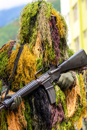 Soldier With An Automatic Rifle Disguised As Sniperの写真素材