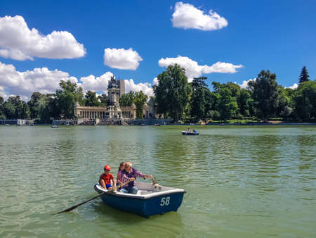 MADRID, SPAIN - JUNE 1, 2014: Unidentified people at Buen Retiro Park in Madrid, Spain. It is the one of the largest parks of the city of Madri.のeditorial素材
