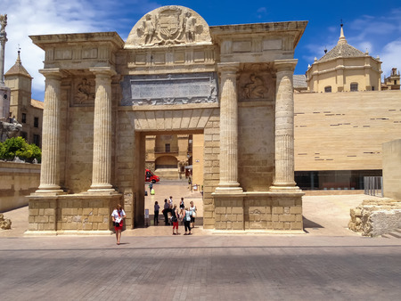 CORDOBA, SPAIN - JUNE 5, 2014: Unidentified people by the Gate of the Bridge (Puerta del Puente) in Cordoba, Spain. It is a Renaissance gate constructed by architect Hernan Ruiz III.のeditorial素材