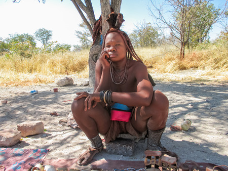 ETOSHA, NAMIBIA - JULY 12, 2014: Unidentified woman from Himba tribe in Etosha National park in...