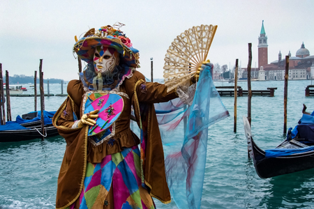 VENICE, ITALY - FEBRUARY 5, 2008: Unidentified person with Venetian carnival mask in Venice, Italy. At 2008 it is held from January 26th to February 5th.のeditorial素材