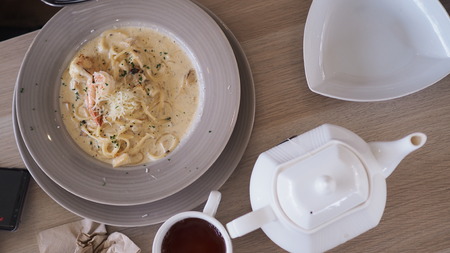 shrimp pasta and tea set.の写真素材