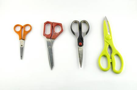 four used Scissors isolated with white backgroundの写真素材