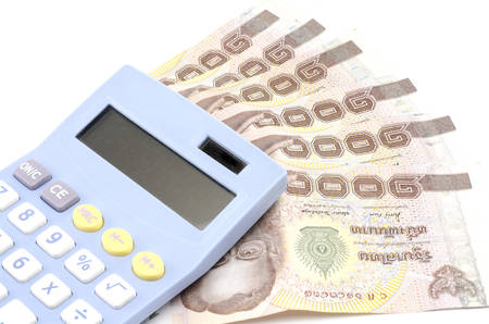 thai banknote with calculator isolated on white backgroundの写真素材