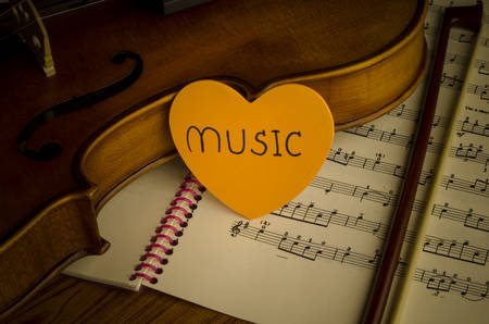 "time to practice violin" violin with sheet music on vintage styleの写真素材