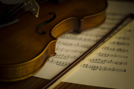 "time to practice violin" violin with sheet music on vintage styleの写真素材