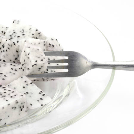 dragon fruit on dish isolated on white backgroundの写真素材