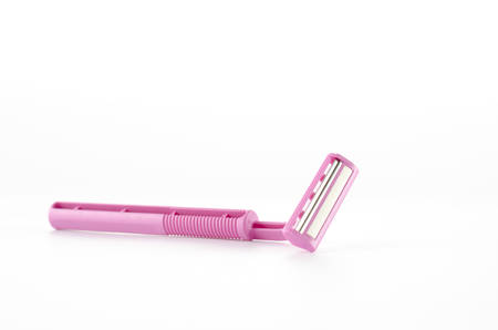 pink disposable shaving on a white backgroundの写真素材